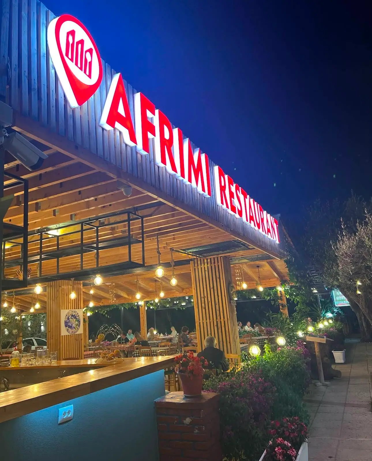 Afrimi terrace at sunset overlooking the Ionian sea in Ksamil