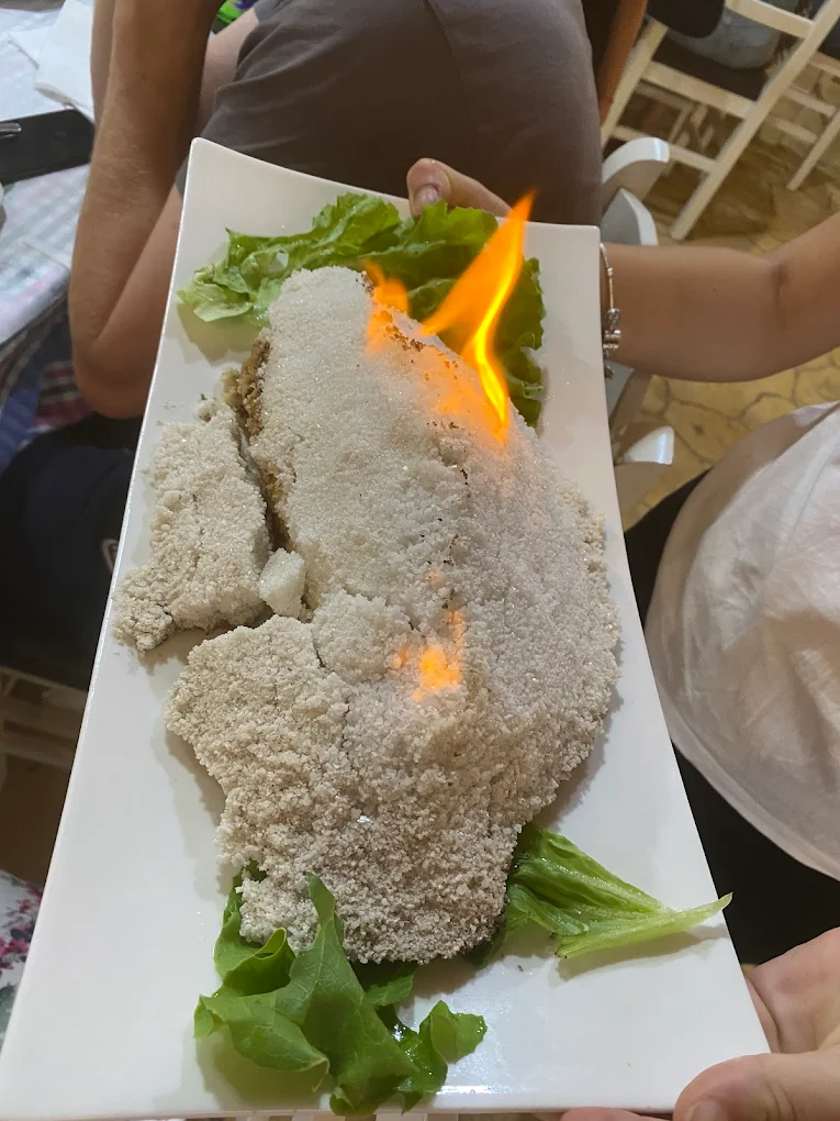 Salt-crust fish flambé served tableside